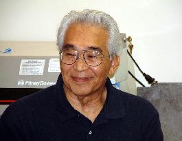 FEATURE: Weightlifting legend began Olympic journey as WWII internee