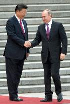 Xi welcomes Putin in Beijing