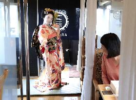 Geisha performance in local train car