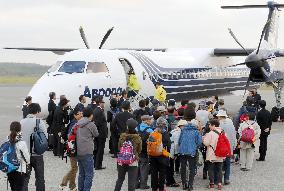 Japanese former residents make 1st trip by air to Russian-held isles