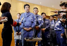 Japan PM Abe visits typhoon-affected area