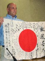 American looking for owner of flag left behind by Japanese solid