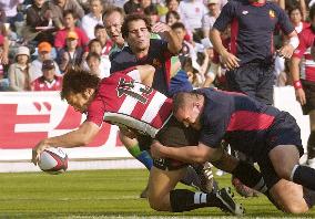 Japan romps over Spain in 1st victory for Elissalde