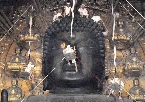 Great Buddha of Nara cleaned by monks