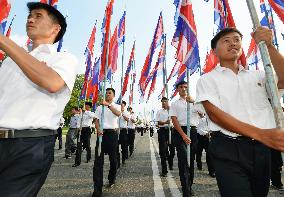 North Koreans march in Pyongyang