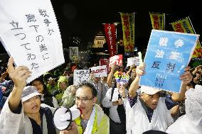 Japan's controversial security bills clear upper house panel