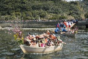 Dolls sent to sea to pray for girls' happiness