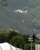 Helicopter works to extinguish forest fire in northeastern Japan