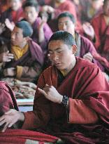 Tibetan monks pray for quake victims