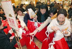 Shoppers jostle for New Year 'lucky bags' at department stores