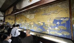 Reporters view Heavenly Maiden painting at Kyoto temple