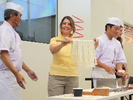 Woman making "Sanuki udon" noodles at Milan Expo Japan Pavilion
