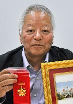 Photojournalist Ishikawa honored for donating his works