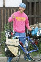 Man in news: Teacher cycles across Japan for after-school classes