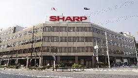 Sharp approves Hon Hai's reduced takeover offer after delay