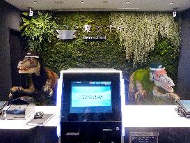 Dinosaur robots welcome clients at hotel near Tokyo Disneyland