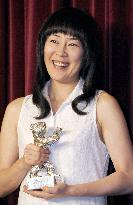 Terajima receives Silver Bear for Best Actress trophy