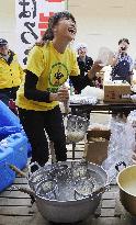 Gold medalist Takahashi at evacuation center