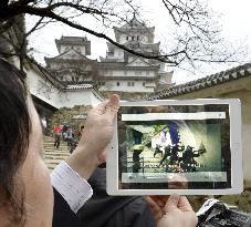 Samurai warriors at castle reproduced on tablet by AR technology