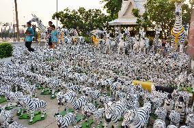 Many zebra statues displayed at animist shrine in Bangkok suburb