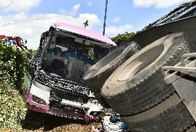 Lorry and coach crash off highway in central Japan