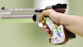 Olympic scenes: Pistol grip covered in stickers