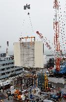 Removal of panels covering Fukushima reactor building starts