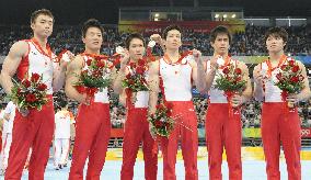 Japan takes team silver in men's gymnastics, China wins