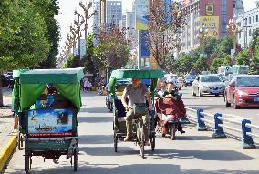 Cycle rickshaws driven by many migrant farmers in China