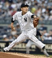 Tanaka wins 6th game with 7 solid innings