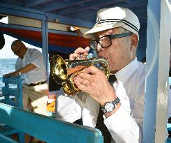Ex-Japan navy band member plays trumpet in memory of fallen comrades