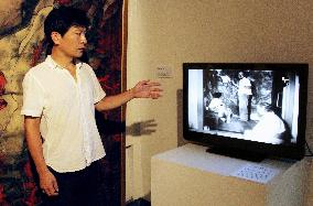 Curator shows video of painter couple drawing "Hiroshima Panels"