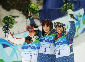 Medalists in women's moguls celebrate their victory