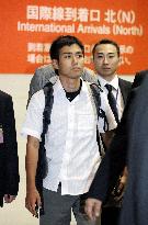 Freed Japanese student arrives home safely