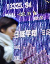 Tokyo stocks plunge on weak domestic data, Asian equity tumbles