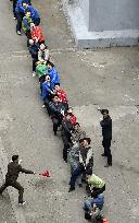 Tug-of-war amid Pyongyang skyscrapers