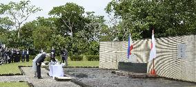 Emperor, empress lay flowers for Japanese WWII dead in Philippines