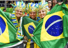 Olympic scene: Brazilian fans in flag-motif costumes