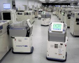 Matsushita system lets multiple robots carry blood samples