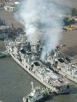 White smoke billows from Indian Navy destroyer in Tokyo Bay