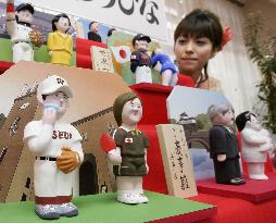 Dolls depicting year's newsmakers shown in Tokyo