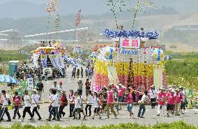 People draw floats at festival in tsunami-hit north Japan