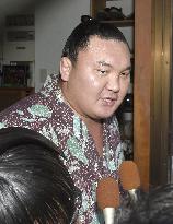 Hakuho's coach arrested over violence