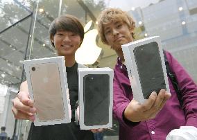 Apple's new iPhones go on sale in Japan