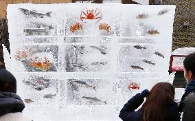 Frozen fish on display at Sapporo Snow Festival