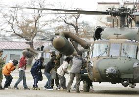 (1)Yamakoshi village children inspect quake damage from helicopt