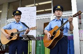 Police officers sing song to warn elderly of fraud targeting them