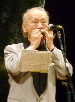 Harmonica man Teramura performs at peace concert in Osaka