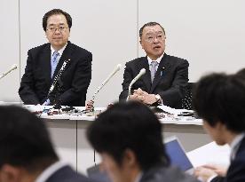 Japan's ruling bloc adopts sales tax hike exemption