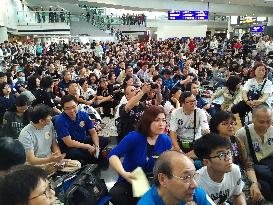 Thousands protest at H.K. airport over aviation security scandal